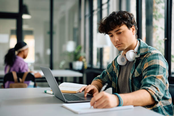 Student working on a laptop at a desk